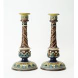 Pair of Doulton Lambeth stoneware candlesticks.