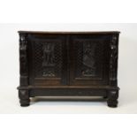 A Victorian oak carved cupboard