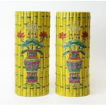 Pair of Chinese yellow bamboo shaped vases.