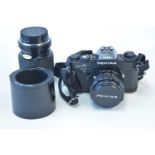 A Pentax camera and lens; and a Tokina lens.