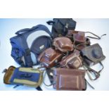 Vintage leather camera cases and film bags.