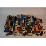 Two boxes of toy vehicles by Dinky, Corgi, Matchbox, and others.