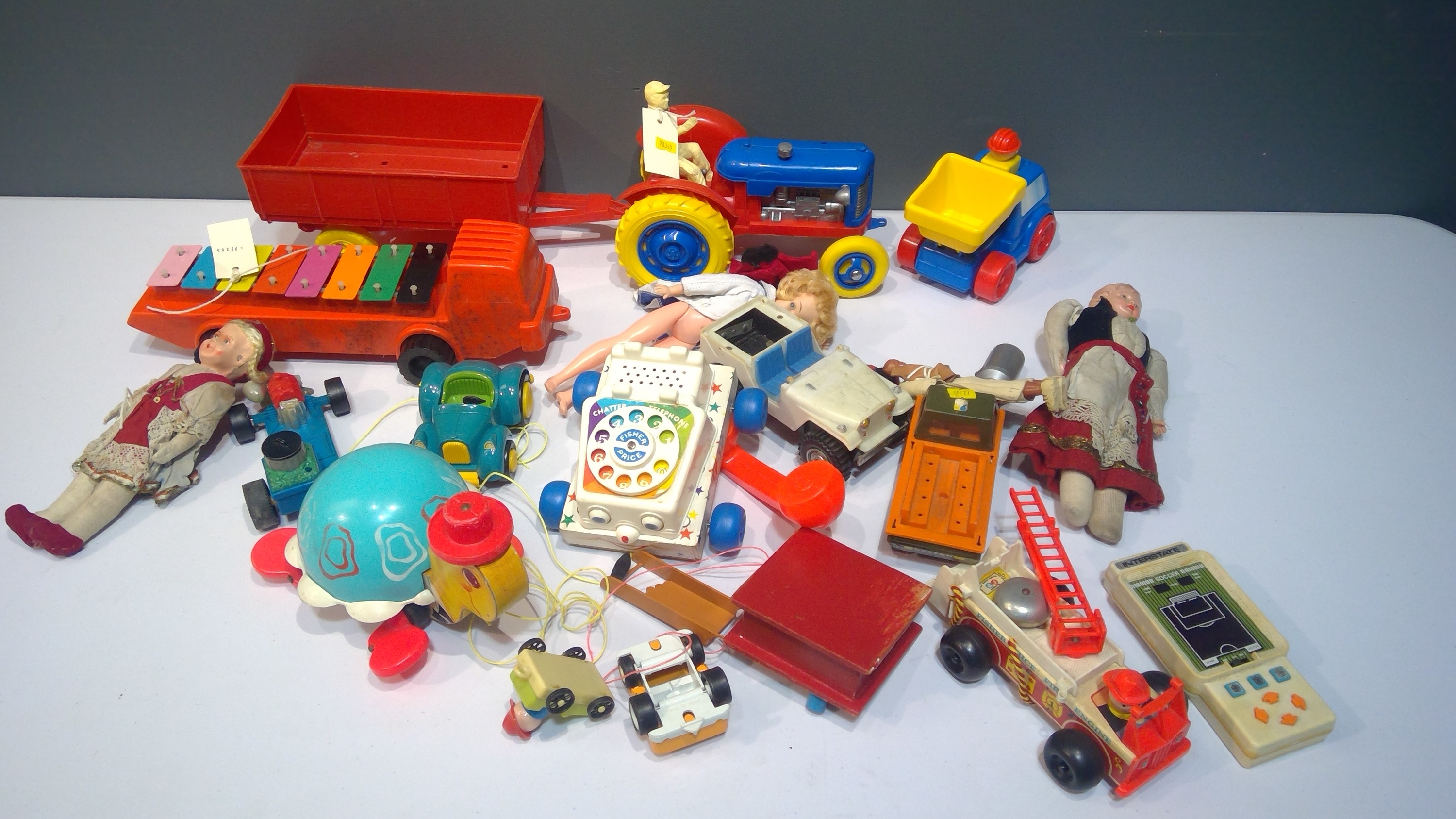 Box of Vintage plastic toys and dolls c1970's by Tri-ang, Tonka, Fisher-Price, and others.