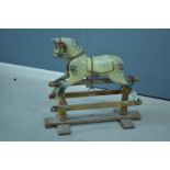 Vintage carved wood and painted rocking horse.
