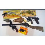 Nine toy guns by Lone star and others.