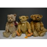Three modern Steiff teddy bears.