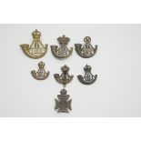 Collection of nine Durham Light infantry cap badges