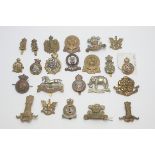 A collection of Hussars regimental cap badges