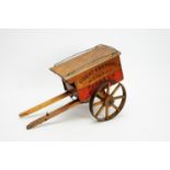 Early 20thC wooden and stencilled toy cart.
