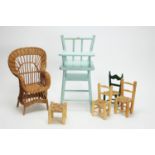 A doll's blue painted wooden high chair; four doll's chairs and a stool.