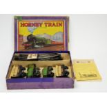 A Hornby M0 clockwork passenger train set.