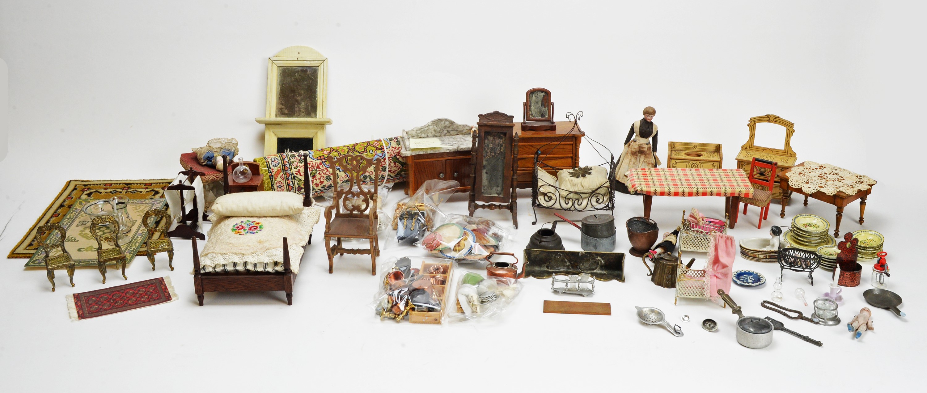 A large collection of doll's house dolls, furniture and other items.