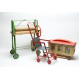 Tri-ang, England: a toy mangle; folding pushchair; and toy caravan.