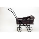 A mid-20th Century doll's pram by Tri-ang,
