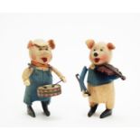 Schuco, Germany: clockwork felt-covered pigs.