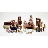 A collection of vintage doll's house furniture.