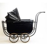 A Marmet doll's pram, c1920's.