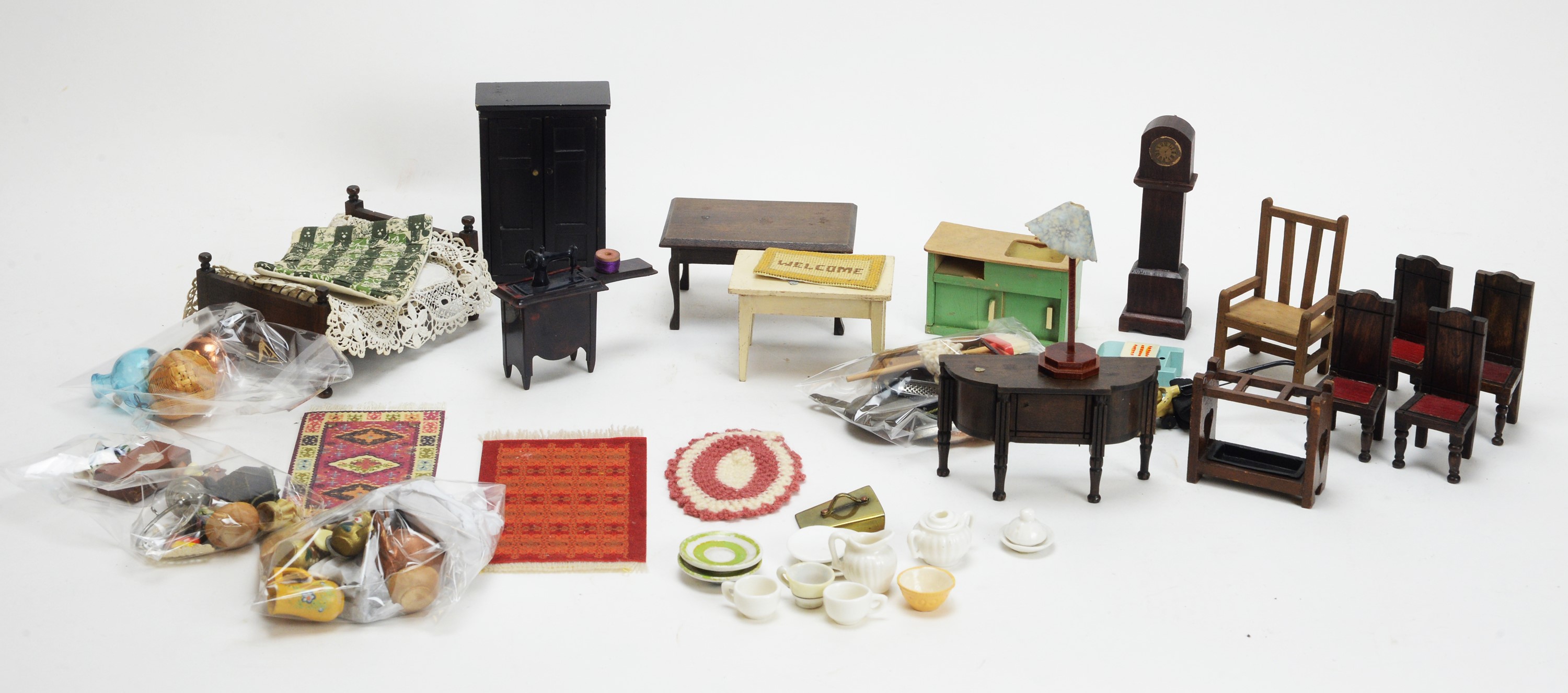 A collection of miniature dolls, furniture and other items.