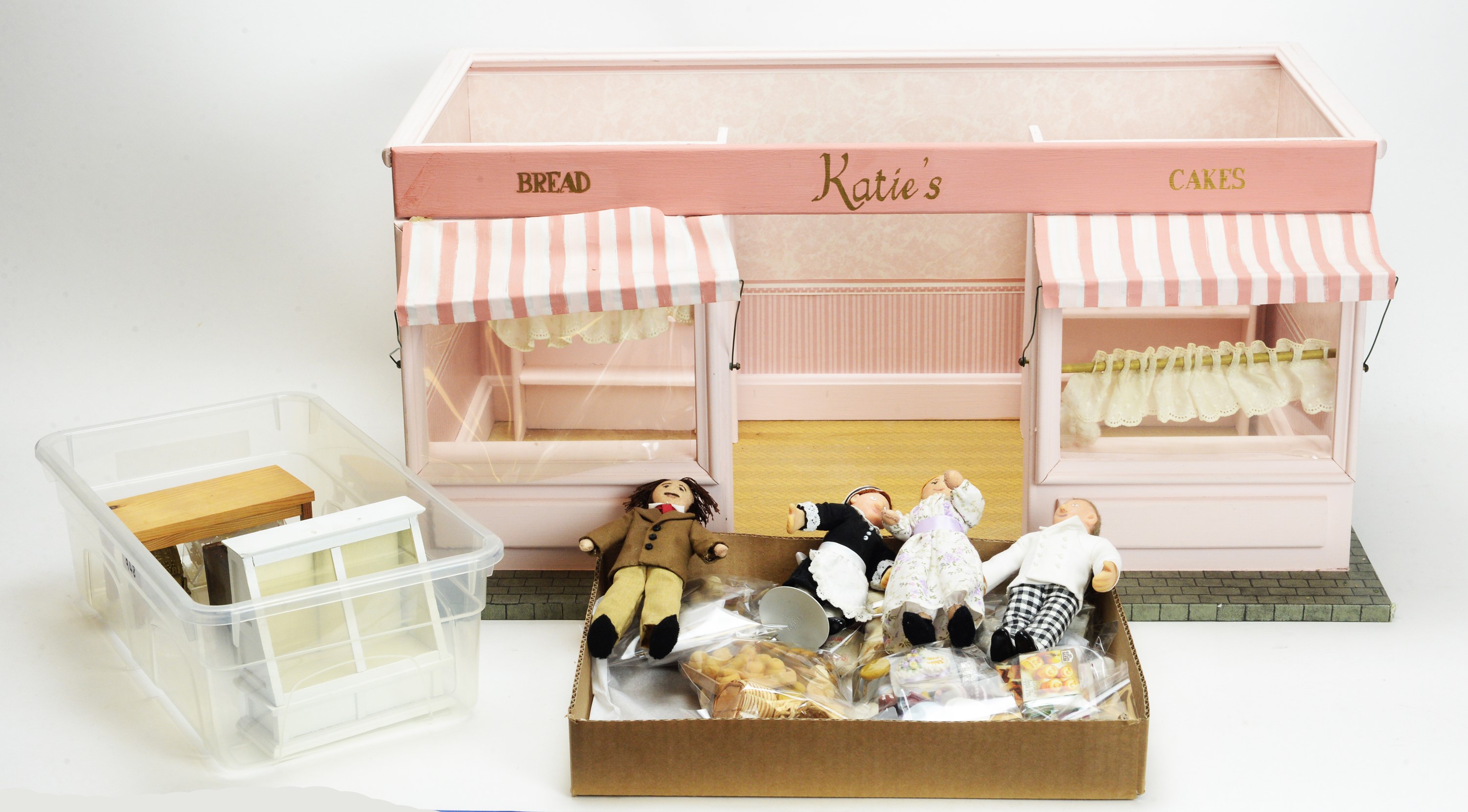 A modern doll's bakery shop "Katie's Bread & Cakes", and accessories.