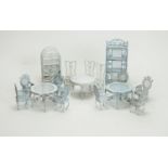 Doll's miniature white-painted metal garden tables and chairs; and shelf units.