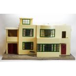 Tri-ang, England: a Model No. 53 modern doll's house,