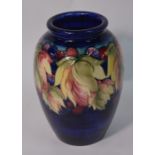A William Moorcroft ovoid vase decorated with the 'Leaf and Berry' pattern