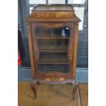 A late 19th/20th century inlaid red walnut music cabinet