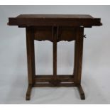 An antique pine/beech artist's easel/table