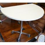 A retro white laminate drop leaf breakfast table on chrome base