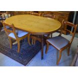 A yew dining suite comprising table and four side chairs and a matching sideboard