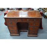 A Victorian mahogany knee-hole campaign style desk