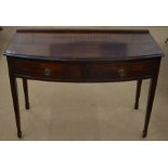 A 19th century mahogany bowfront hall table with two frieze drawers raised on tapering square