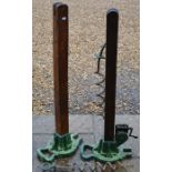 A pair of early 20th century oak and cast iron lawn tennis net posts, 'Ayres Patent Championship