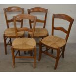 A set of four rush seated dining chairs