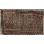 An antique Belouch rug