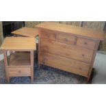 A large pine chest with three short and two long drawers with turned handles to/w a pair of matching