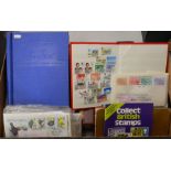 A box containing several albums of First Day Covers