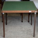 A folding card table with green baise top
