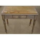 An antique pine hall table with single frieze drawer, raised on turned supports