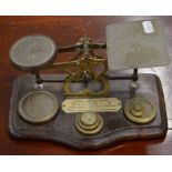 A Victorian set of mahogany and brass letter scales with weights