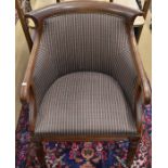 A Regency style armchair with striped upholstery and turned reeded front supports