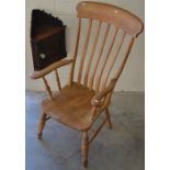 A beech Windsor style elbow chair to/w a small carved oak corner cupboard (2)
