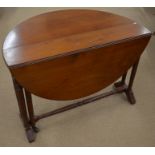 A Victorian mahogany Sutherland table on ring turned gateleg action supports