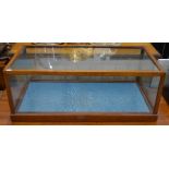 An early 20th century mahogany glazed rectangular table top vitrine