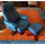 A 'Stressless' style revolving  armchair and matching footstool in blue leather upholstery (2)