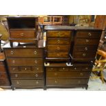 Stag Furniture - a trio of bedside chests to/with a tall chest of drawers, another low chest (5)