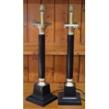 A pair of black and brass column table lamp stands by Vaughan, London (2)