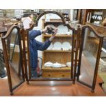A mahogany framed arched triptych dressing table mirror