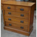 An Edwardian satinwood chest of two short over three long drawers raised on a plinth base