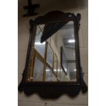 A Regency style fret-cut mirror with gilded slip
